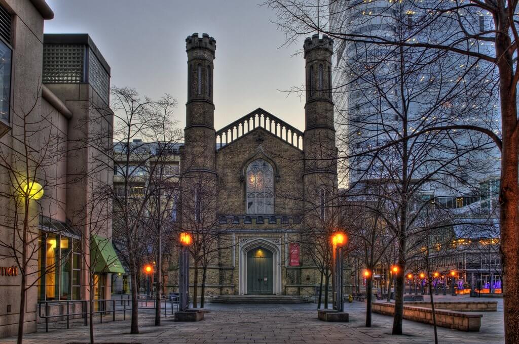 Looking at the west doors of Holy Trinity from Bay St.