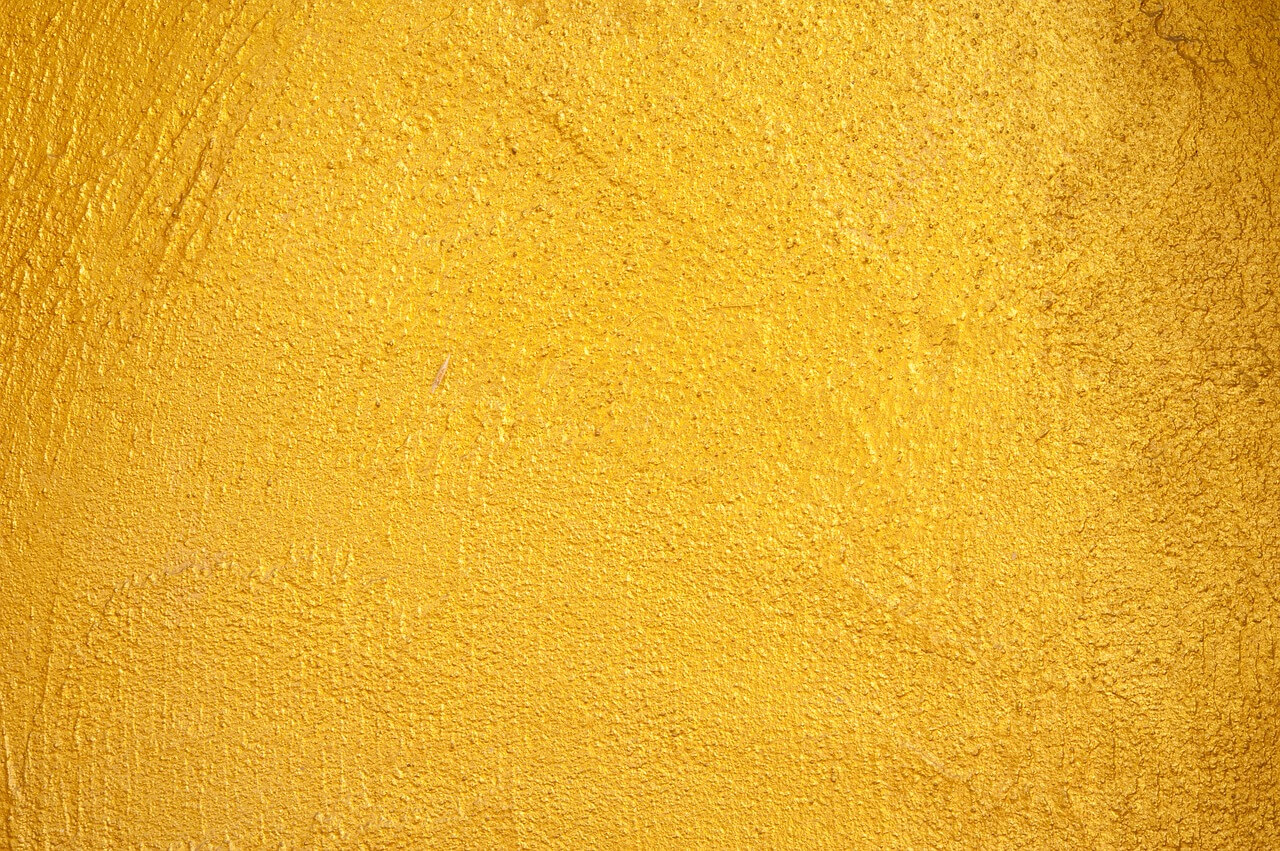 yellow paint texture on a stucco wall