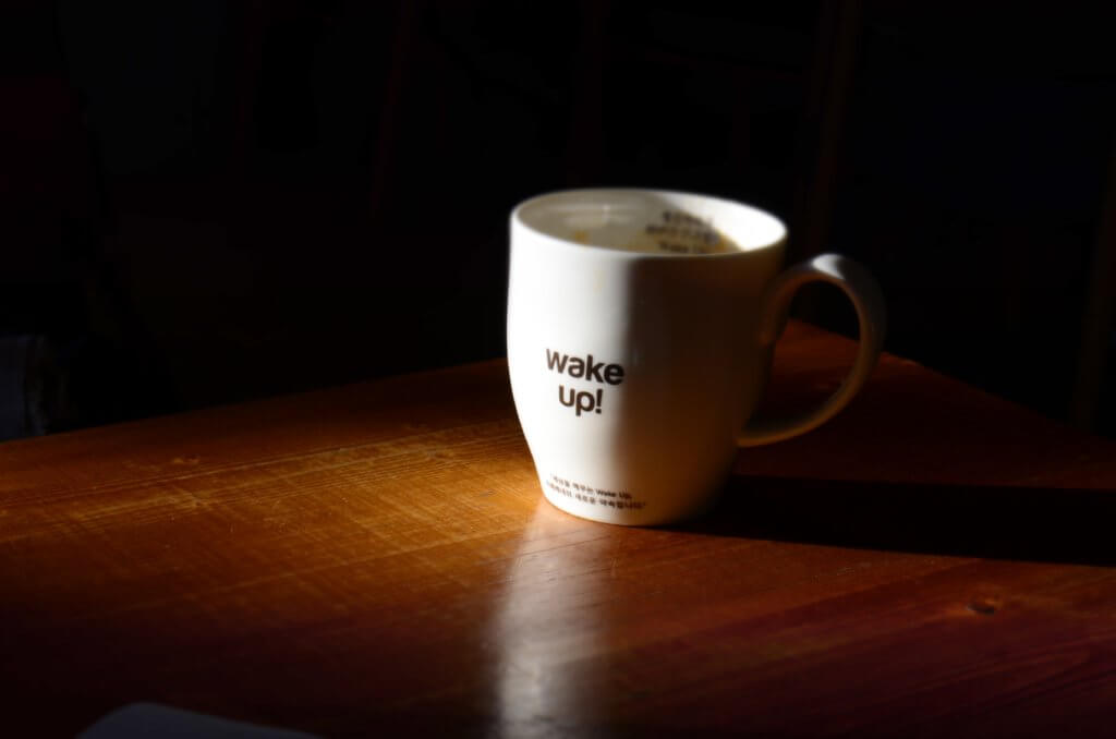 photo of a coffee mug that says "wake up!"