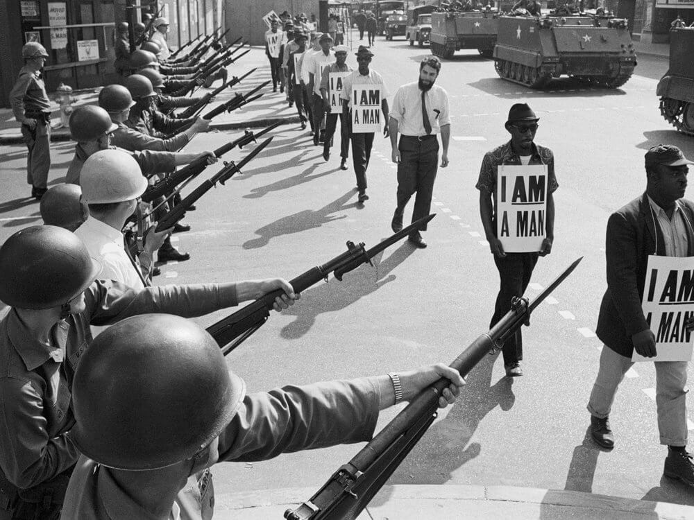 Photo of marchers wearing "I am a man" signs at the 1968 Memphis Sanitation Workers’ Strike